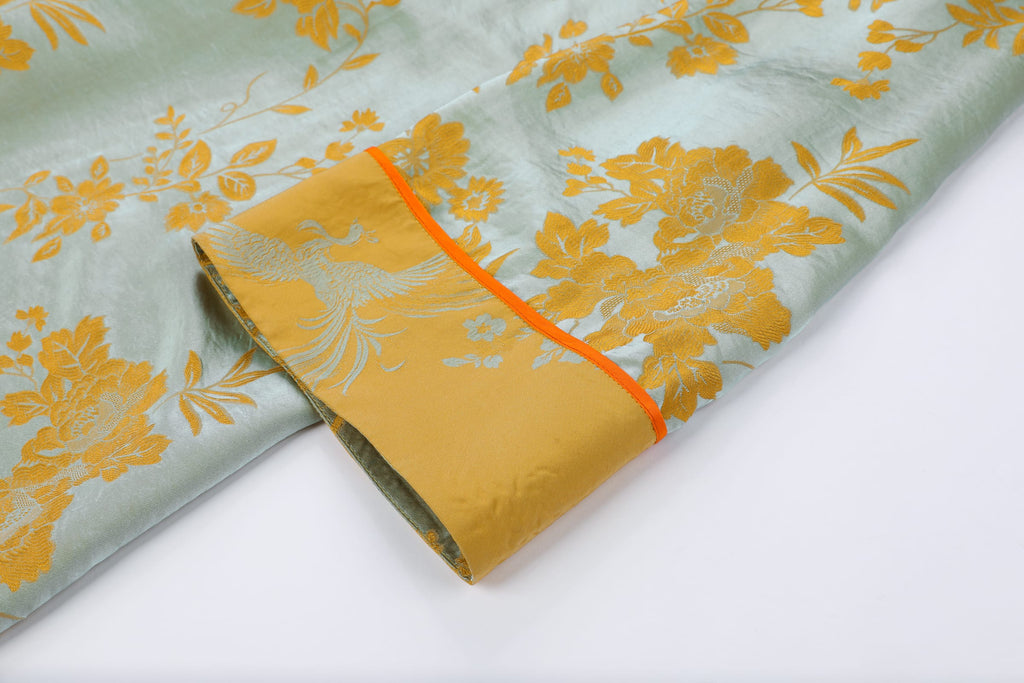 Chinese Silky Phoenix Brocade Abaya (Neon Orange) — cuff detail with orange piping and gold-toned motifs