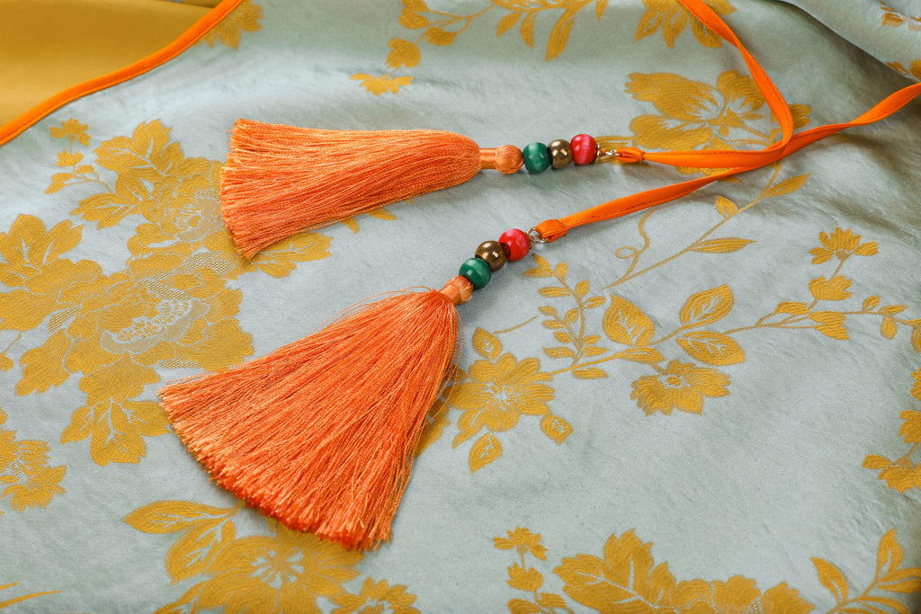 Chinese Silky Phoenix Brocade Abaya (Neon Orange) — close-up of orange tassels with coloured beads