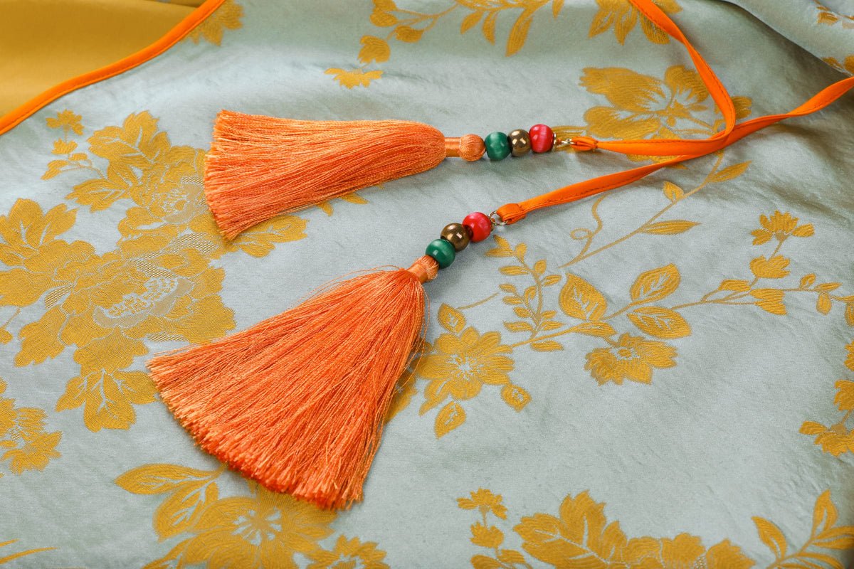 Chinese Silky Phoenix Brocade Abaya (Neon Orange) — close-up of orange tassels with coloured beads