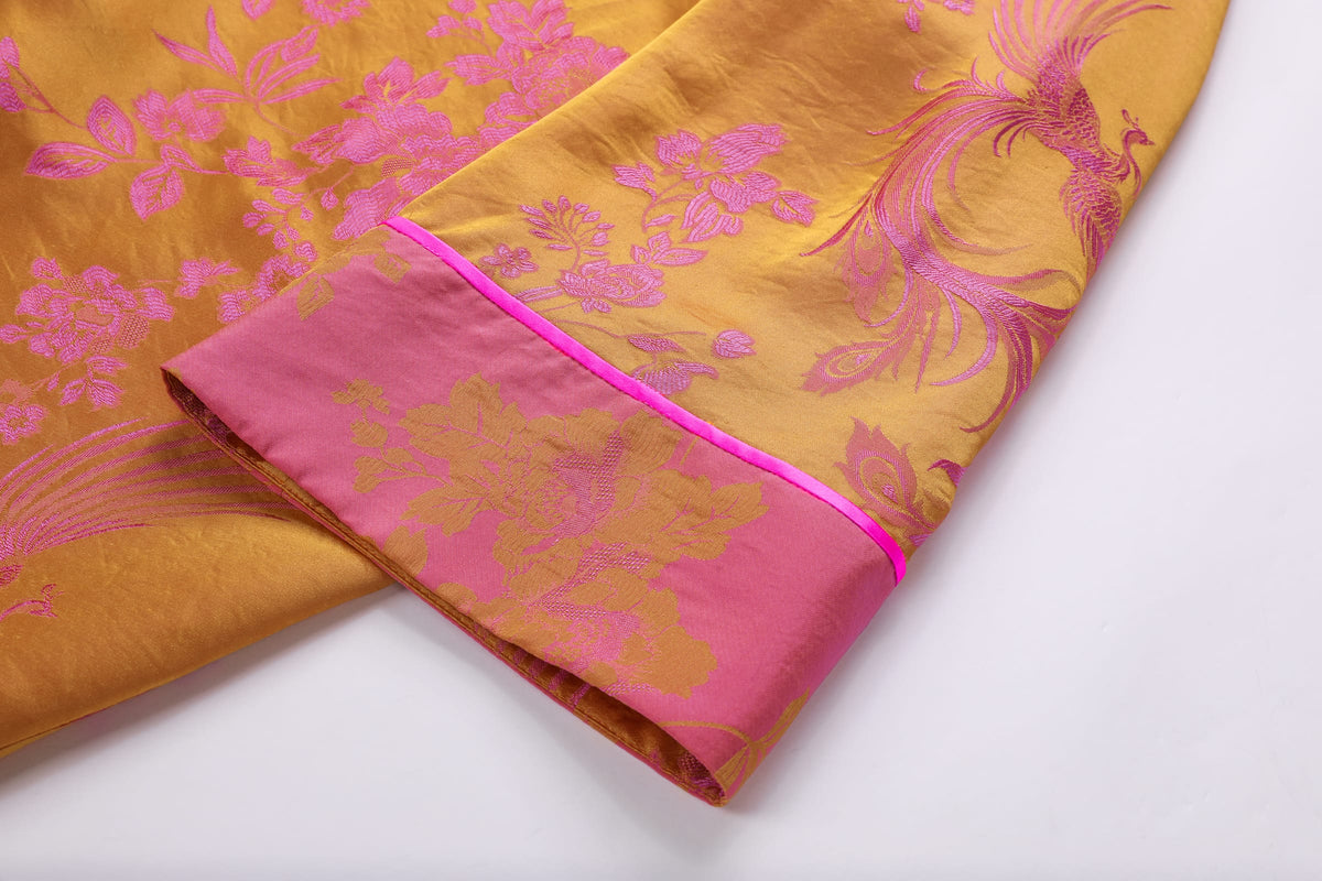 Chinese Silky Phoenix Brocade Abaya (Neon Pink) — cuff detail with pink piping and woven phoenix motifs