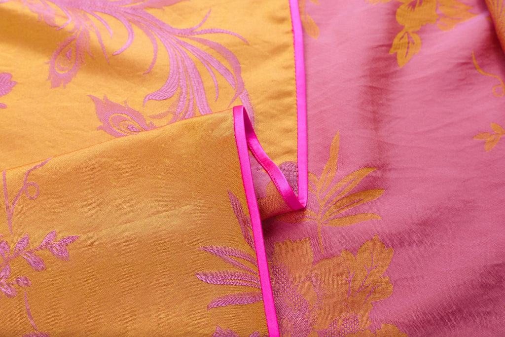 Chinese Silky Phoenix Brocade Abaya (Neon Pink) — open-front edge showing pink piping and the fabric reverse