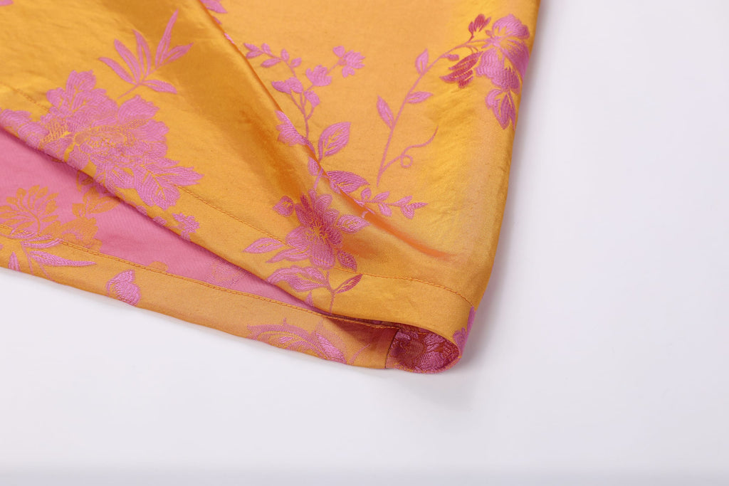 Chinese Silky Phoenix Brocade Abaya (Neon Pink) — folded hem detail with pink woven motifs