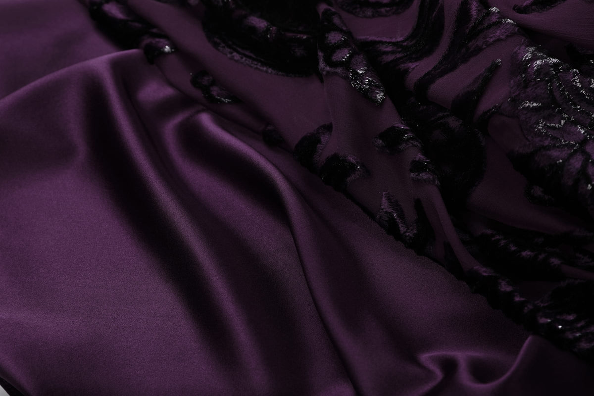 Plum Silk Velvet Layered Abaya — close-up of smooth plum fabric beside the patterned outer layer